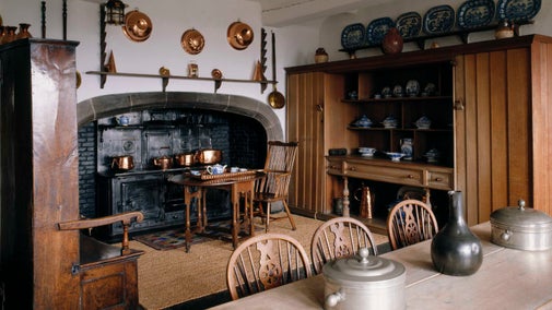 The Kitchen, showing the coal-fired range and copper pans at Lindisfarne Castle, Northumberland